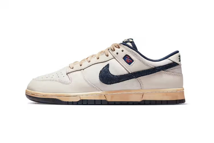 Official Look at the ‘Stranger Things’ x Nike Dunk Low in “Phantom/Midnight Navy” was revealed.