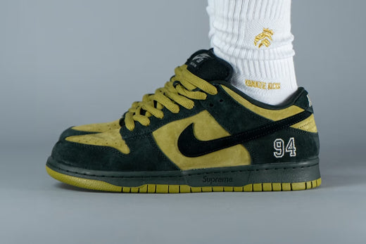 A closer look at the Supreme x Nike SB Dunk Low in “Camper Green.”