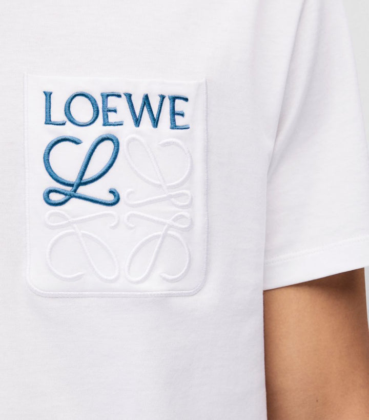 White Loewe Anagram Pocket T-Shirt available at Hype Vault, featuring an embroidered Loewe logo and signature anagram on the chest pocket, crafted from premium cotton for a relaxed fit and luxurious minimalist style.